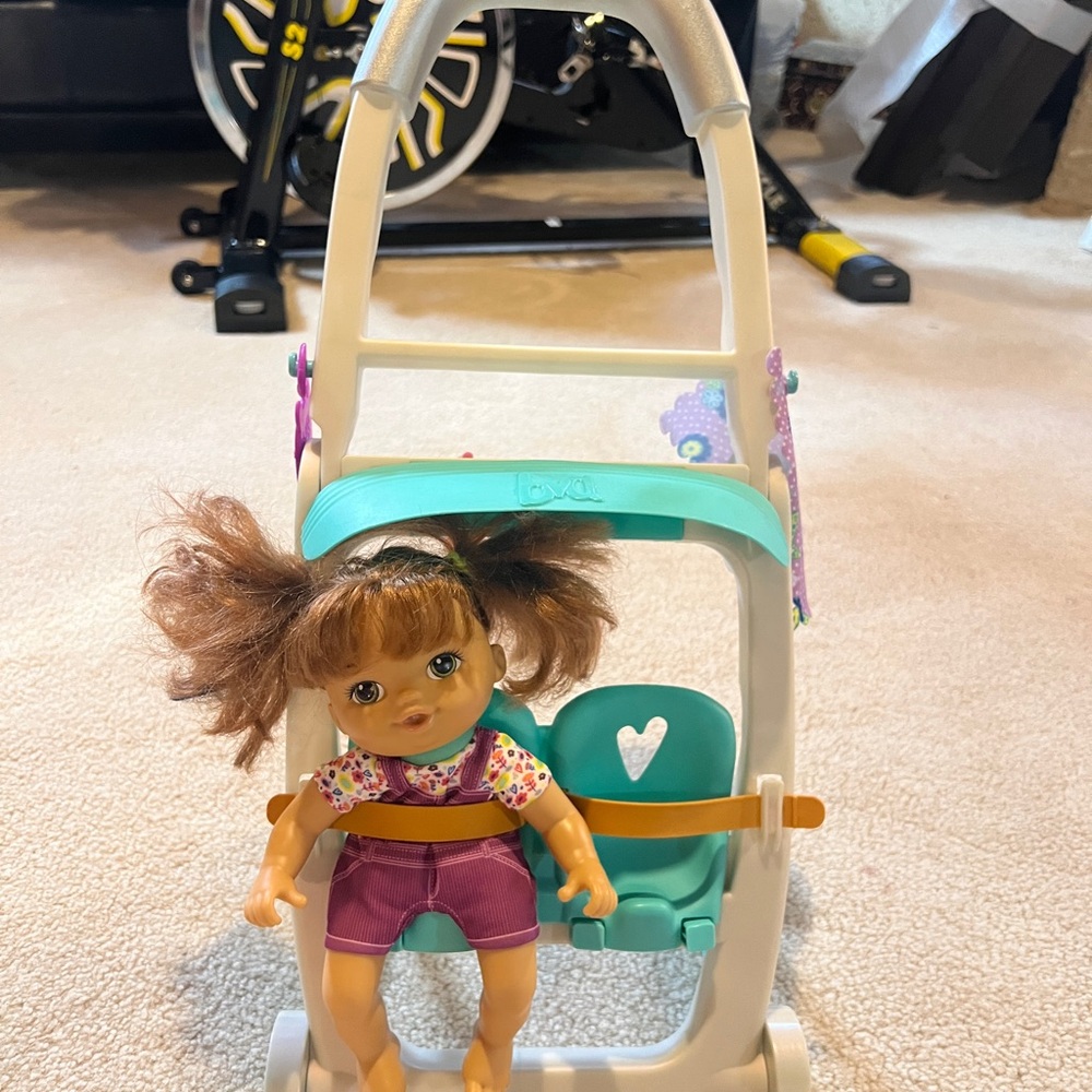 Baby doll with stroller and accessories like new